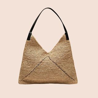 Flat lay image of a raffia tote bag