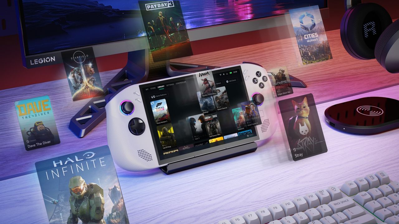 The Lenovo Legion Go S in a dock on a desk, with various games hovering around it.