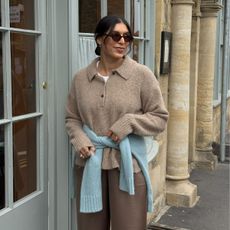 An image of @indiaedit wearing one of the biggest cardigan colour trends of 2025. 