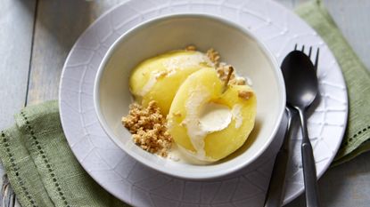 Chardonnay poached apples with crunchy granola and cream