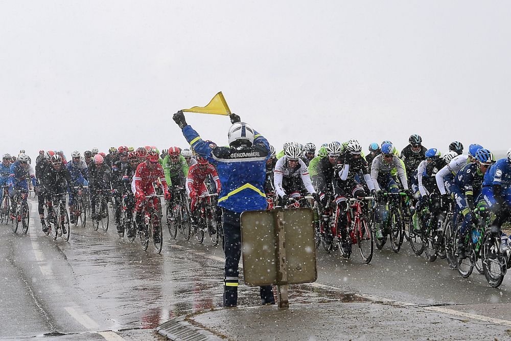 Road furniture and snow mix during stage 1 at Paris-Nice.