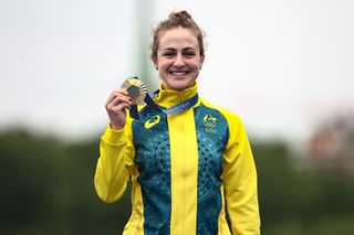 Australia's Grace Brown celebrates with her gold medal on the podium during the medal ceremony for the women's road cycling individual time trial during the Paris 2024 Olympic Games in Paris, on July 27, 2024. (Photo by Anne-Christine POUJOULAT / AFP)