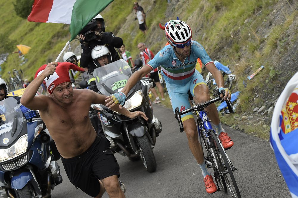 Vincenzo Nibali interacts with a spectator along the route.