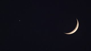 A crescent moon at night