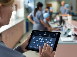 Hospital worker using an iPad