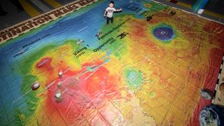 Aldrin has been taking Giant Mars Maps to schools. Credit: Chuck Davis (draconoir)