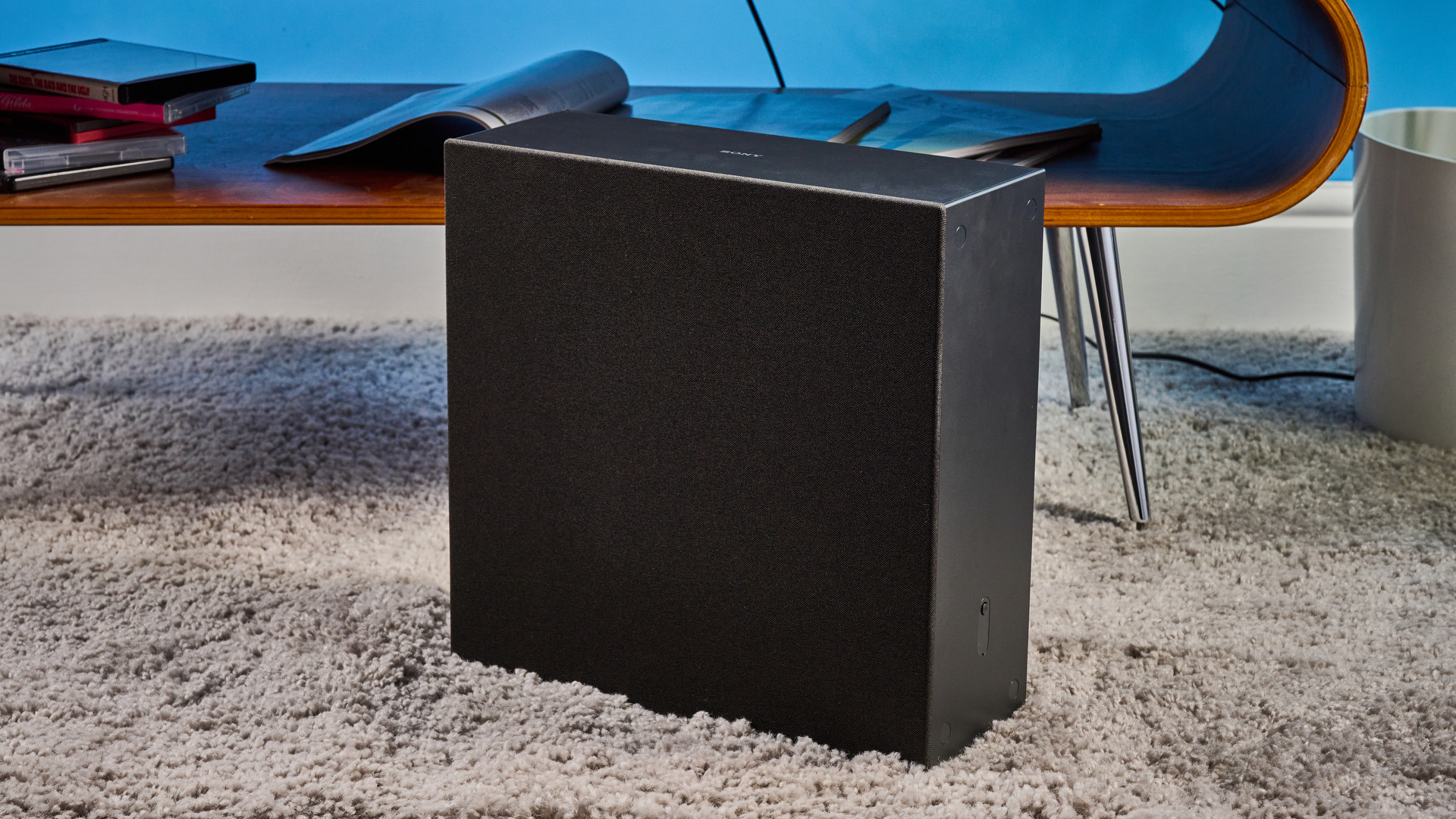 the sony bravia theater bar 7 photographed with the subwoofer with a TV on the tom's guide blue background