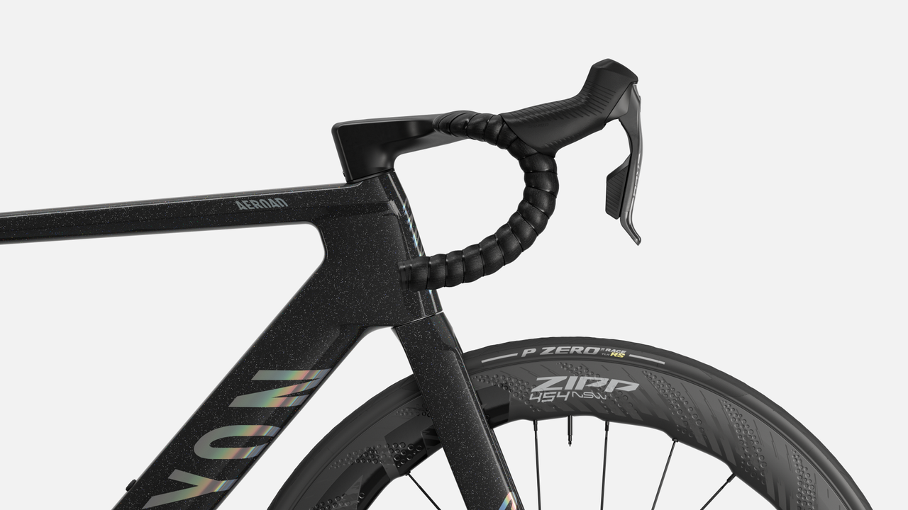 A canyon bike is shown side on cropped in on the handlebar