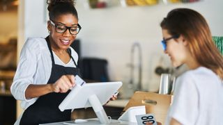 Food SMB owner uses white POS system with customer