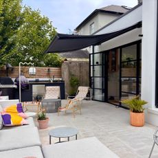 open crank awning on a patio with seating