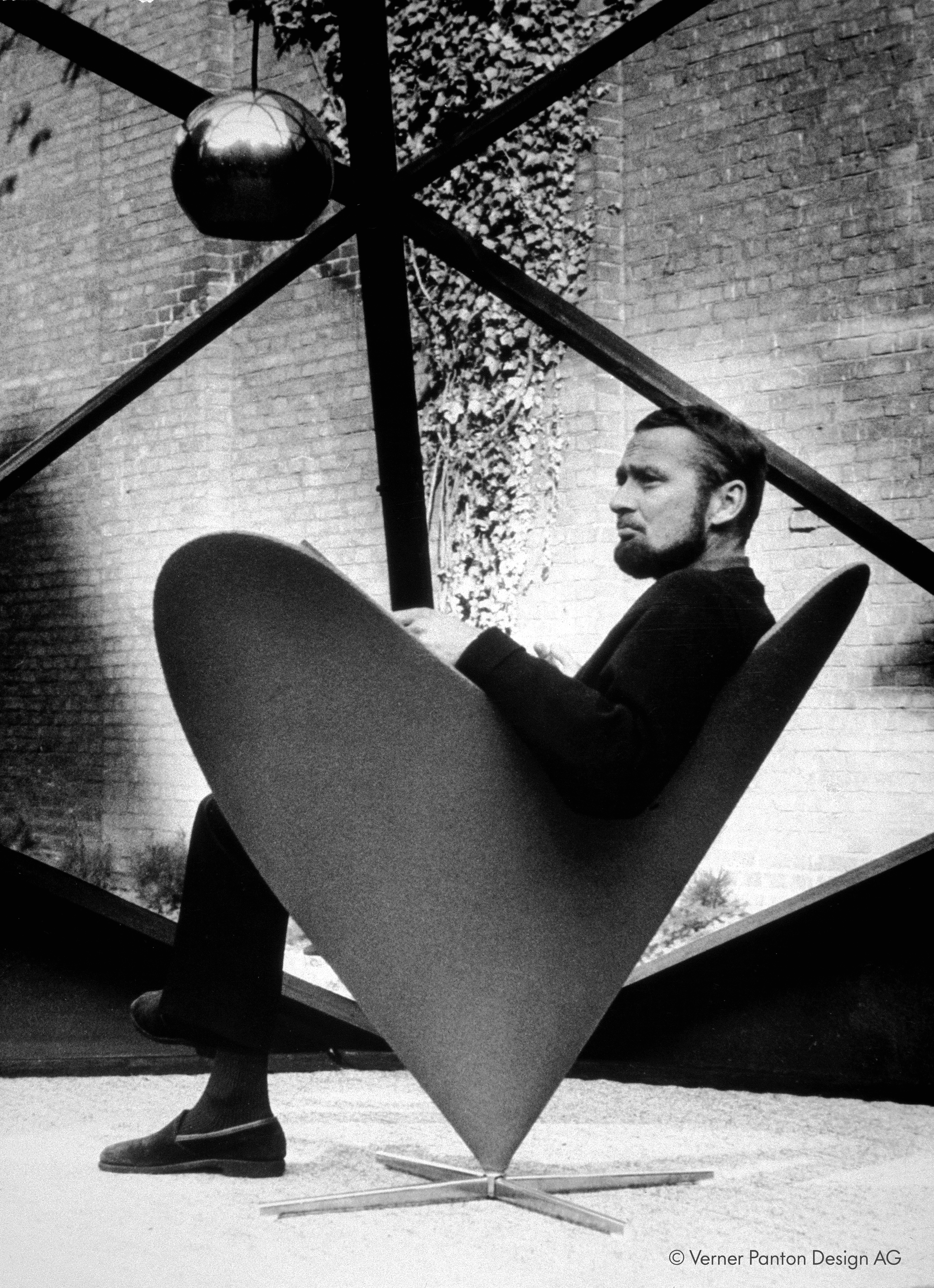 Verner Panton seated in a Heart Cone chair