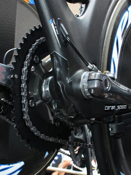 Garmin-Slipstream team mechanics add some tape to the bottom of Bradley Wiggins' bike to help smooth airflow over the exiting Shimano Dura-Ace Di2 wires and harness.