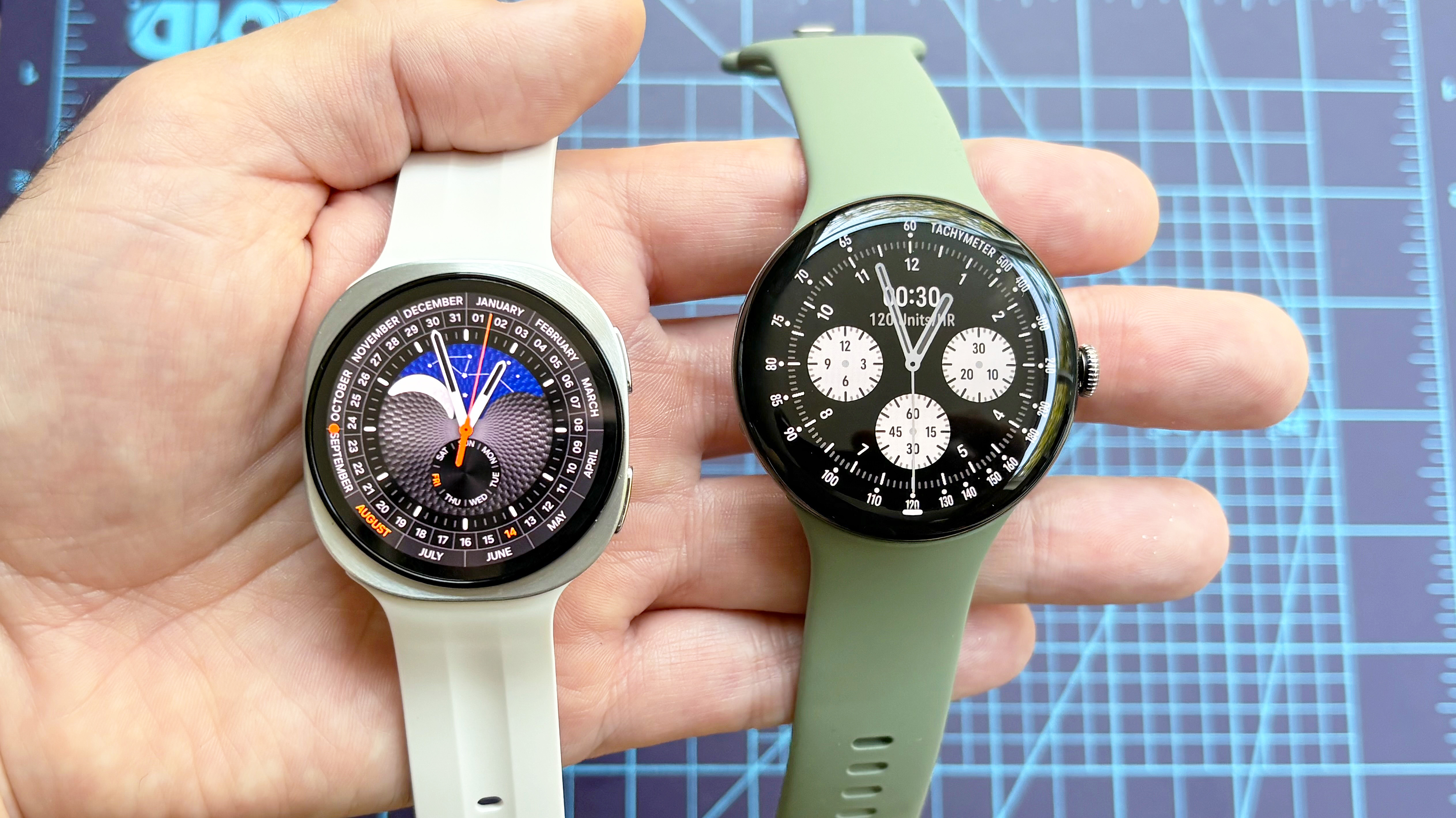 Close-up of the Samsung Galaxy Watch 9 next to the Google Pixel Watch 5