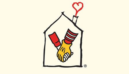 RMHC logo design showing Ronald McDonald's gloved hand holding a child's hand