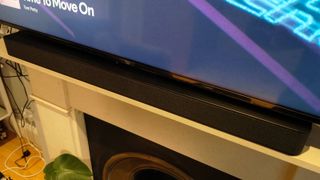 The Amazon Fire TV Soundbar Plus under an Amazon TV.