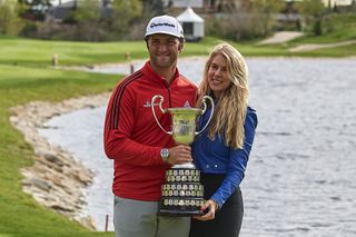 Jon Rahm and girlfriend Kelley Cahill pose with the 2018 Open de Espana trophy