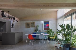 The kitchen and dining area are set beneath the pitched roof