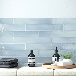 Pastel blue subway tile bathroom backsplash 