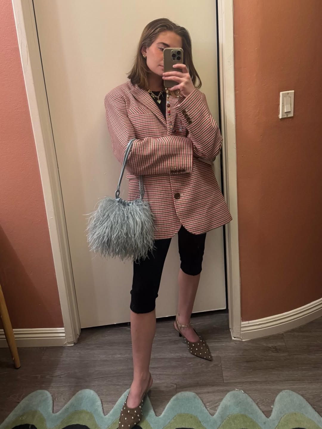 Kelsey Stewart with a feather bag