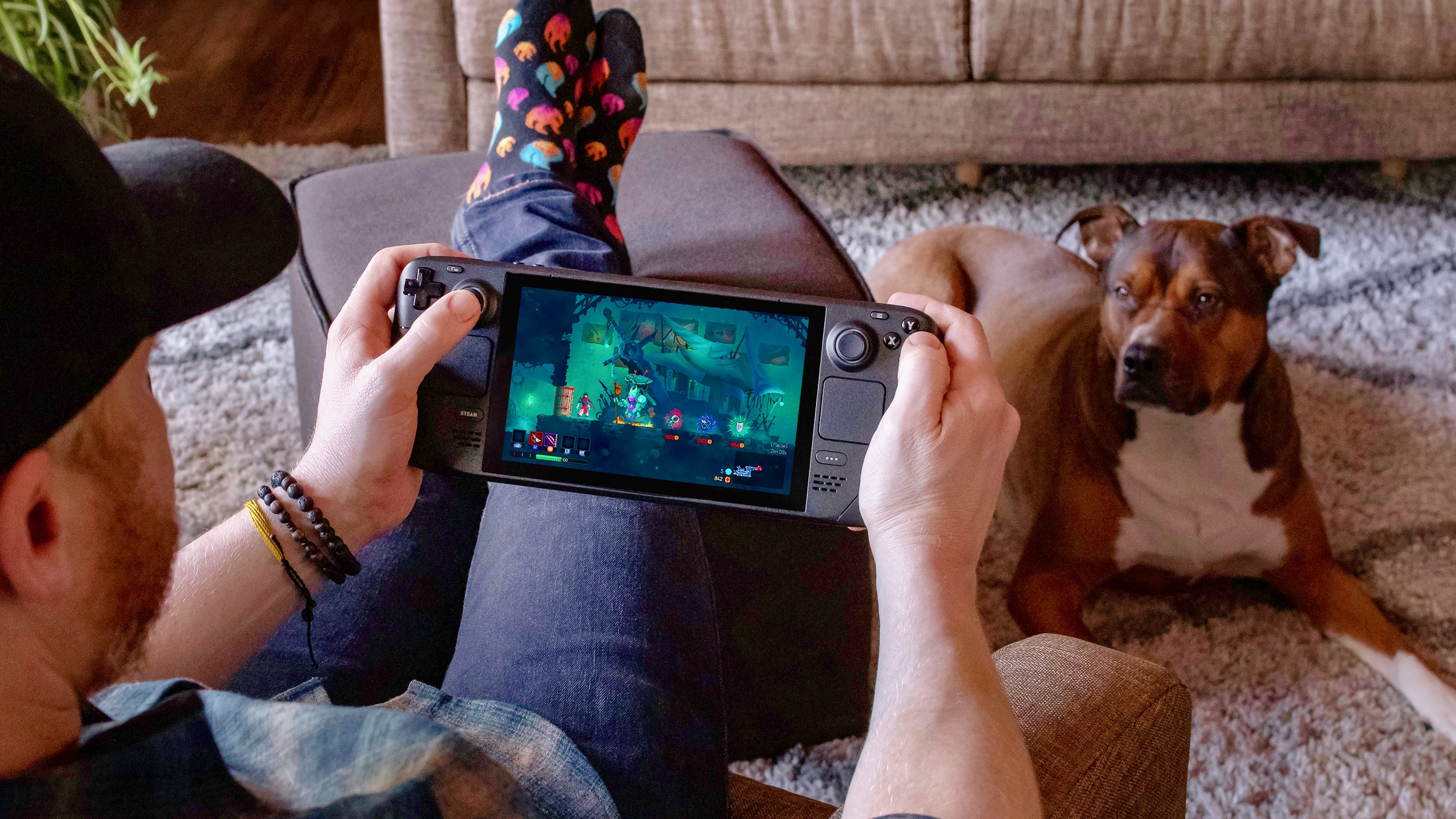Person holding a Steam Deck in their hands playing a game on it