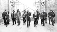 Tedeschi Trucks Band walking down an alleyway