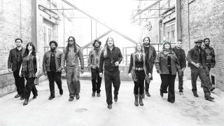 Tedeschi Trucks Band walking down an alleyway