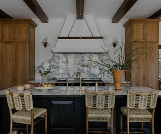 wooden kitchen with larger marble backsplash
