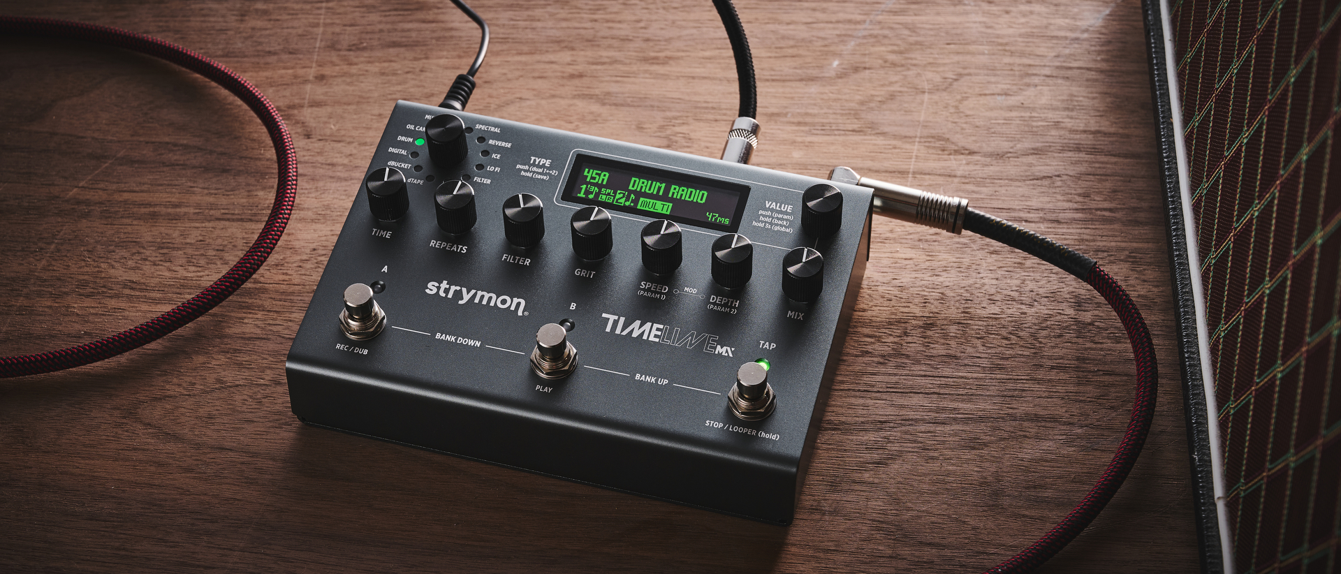 A Strymon TimeLine MX delay pedal on a wooden floor