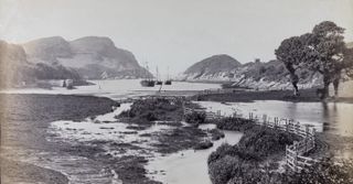 Black and white image of an estuary and some fishing boats