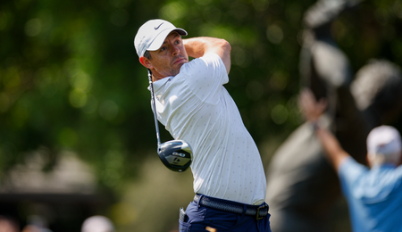 Rory McIlroy strikes a tee shot with a driver