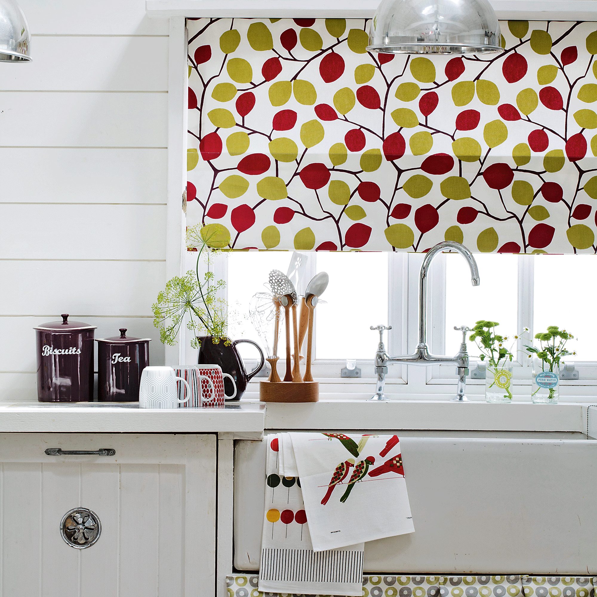 Patterned blinds over white sink