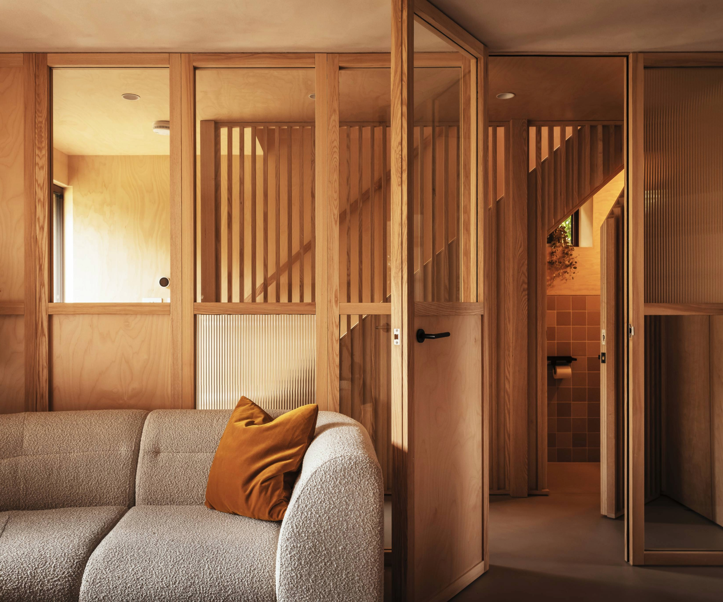 Living room with wooden glass doors and sofa