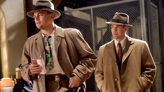 Leonardo DiCaprio as Edward "Teddy" Daniels and Mark Ruffalo as Chuck Aule walking in a prison in the thriller movie Shutter Island