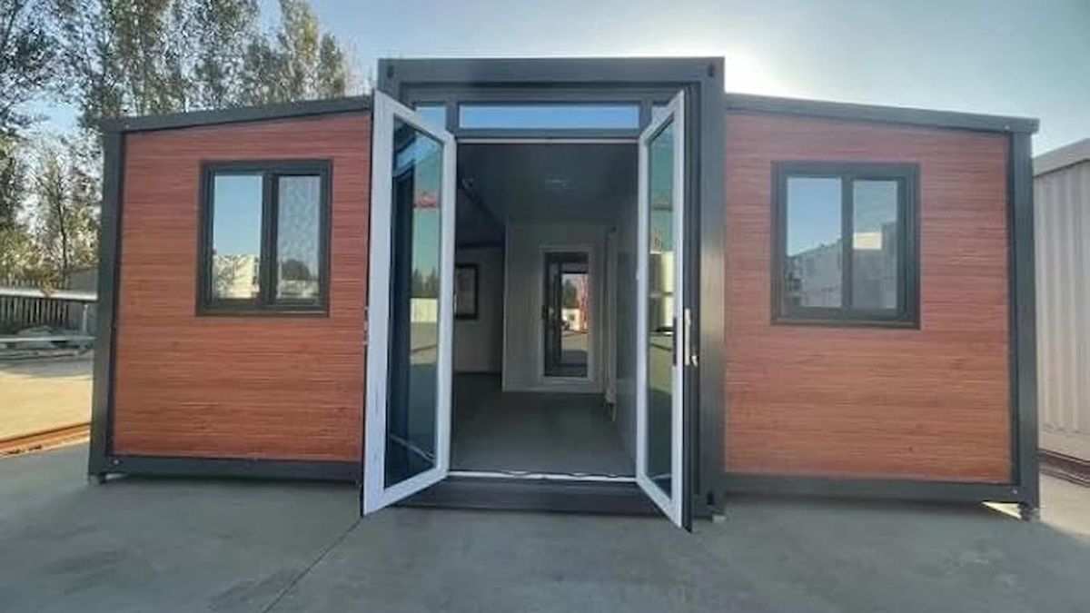 An Amazon Tiny Home with an open bifold front door looking into the house