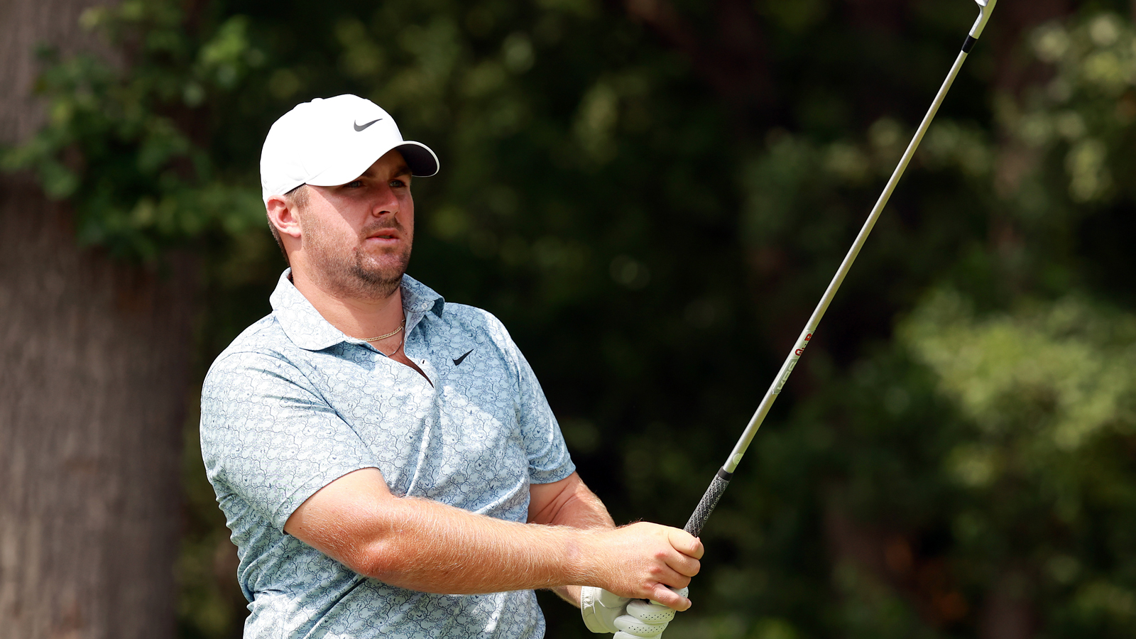 Chris Gotterup hits an iron shot