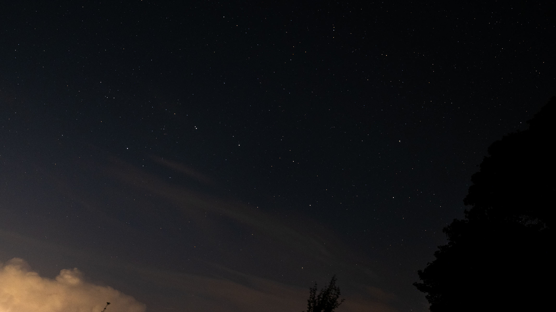 The Big Dipper asterism in the starry night sky with a cloud in bottom left corner as photographed by the Fujifilm GFX100S II.