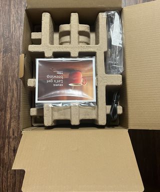 Keurig K-Elite in cardboard box packaging with information booklet