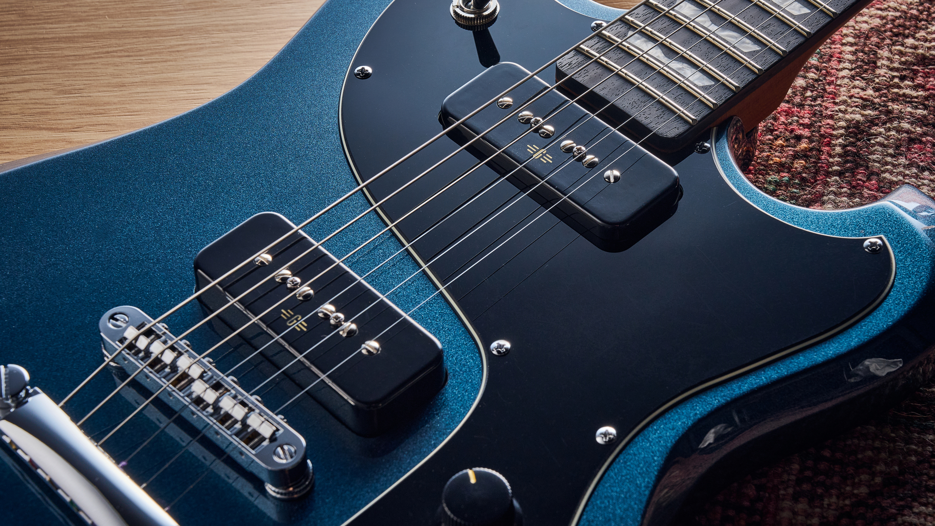 Close up of the P-90 pickups on the Baum Carve electric guitar