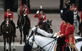 Queen Elizabeth ll takes the salute as she rides on horseback during the Trooping the Colour ceremony
