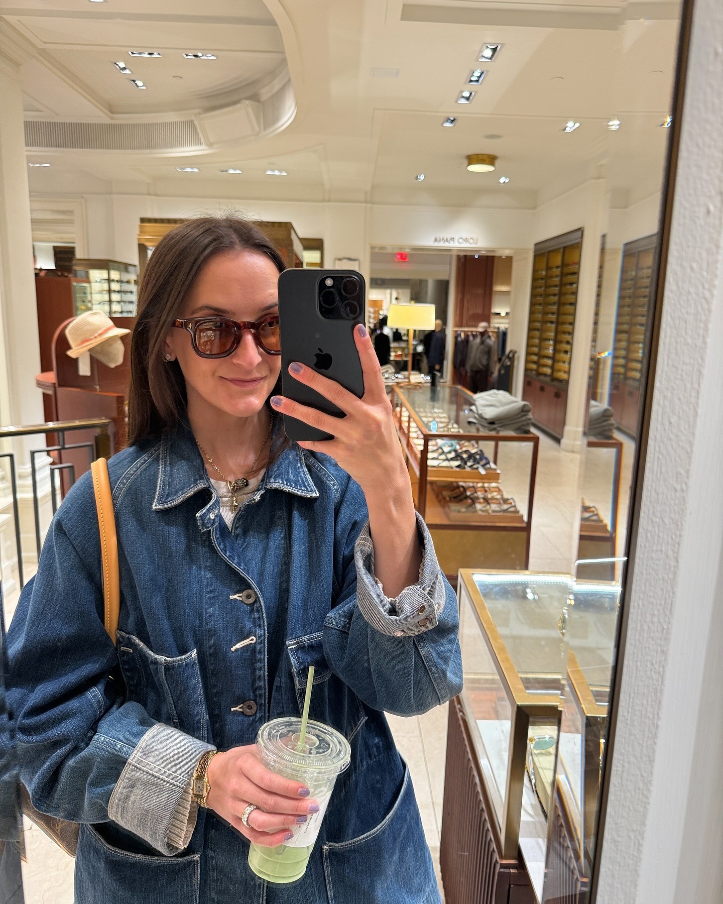 Rachel Whitehouse posing in mirror with sunglasses on