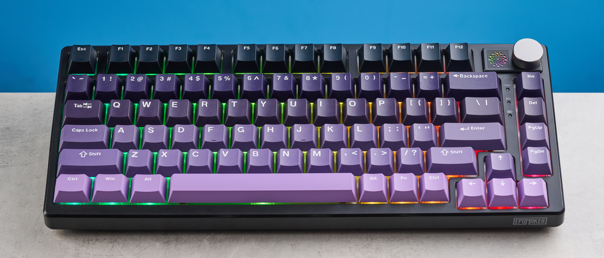 The Epomaker HE75 Mag on a stone surface with a blue background