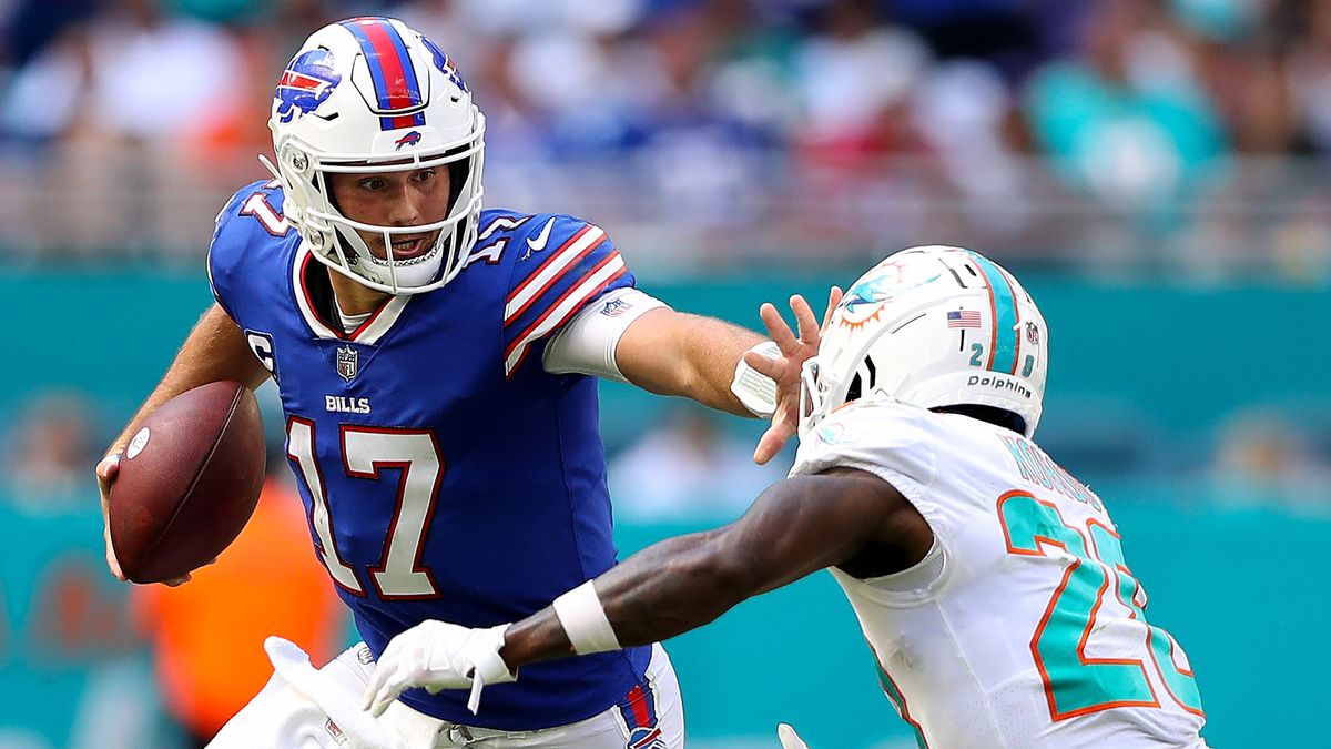 Buffalo Bills&#039; Josh Allen stiff arms Miami Dolphins&#039; player