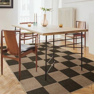 Ruggable soft black and jute area rug under wooden dining table