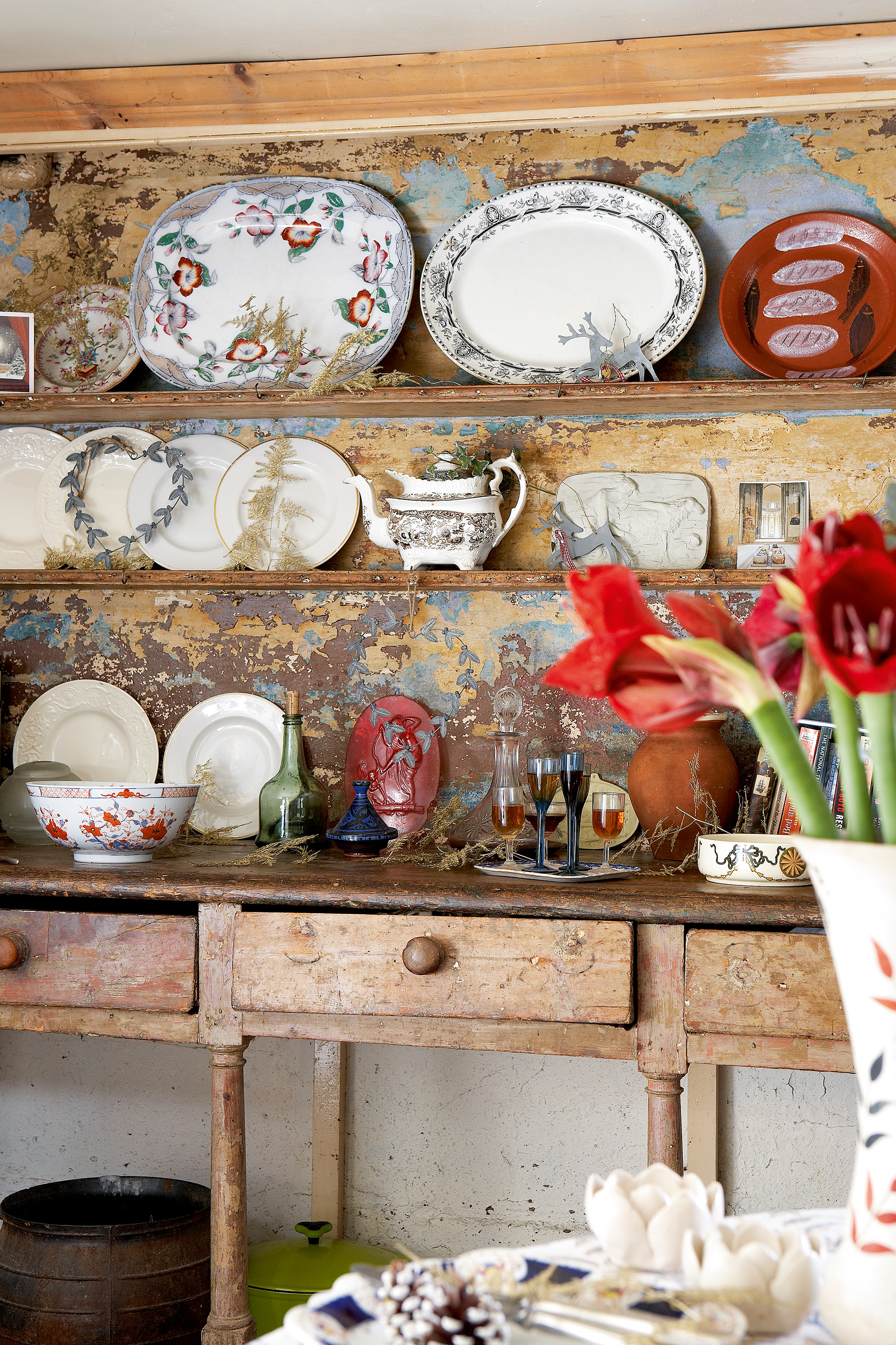 styling shelves: antique distressed shelving with ornamental plates