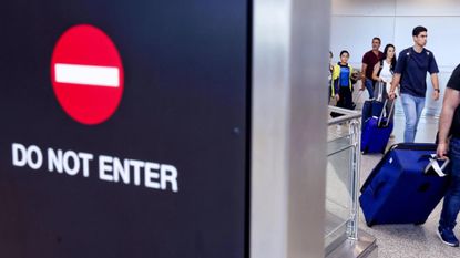 Travelers from Latin America and the Caribbean arrive at Miami International Airport