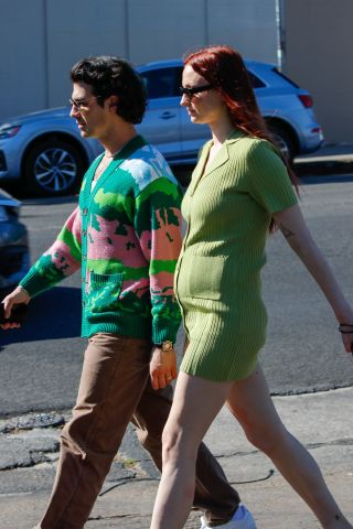 Sophie Turner in knit green dress