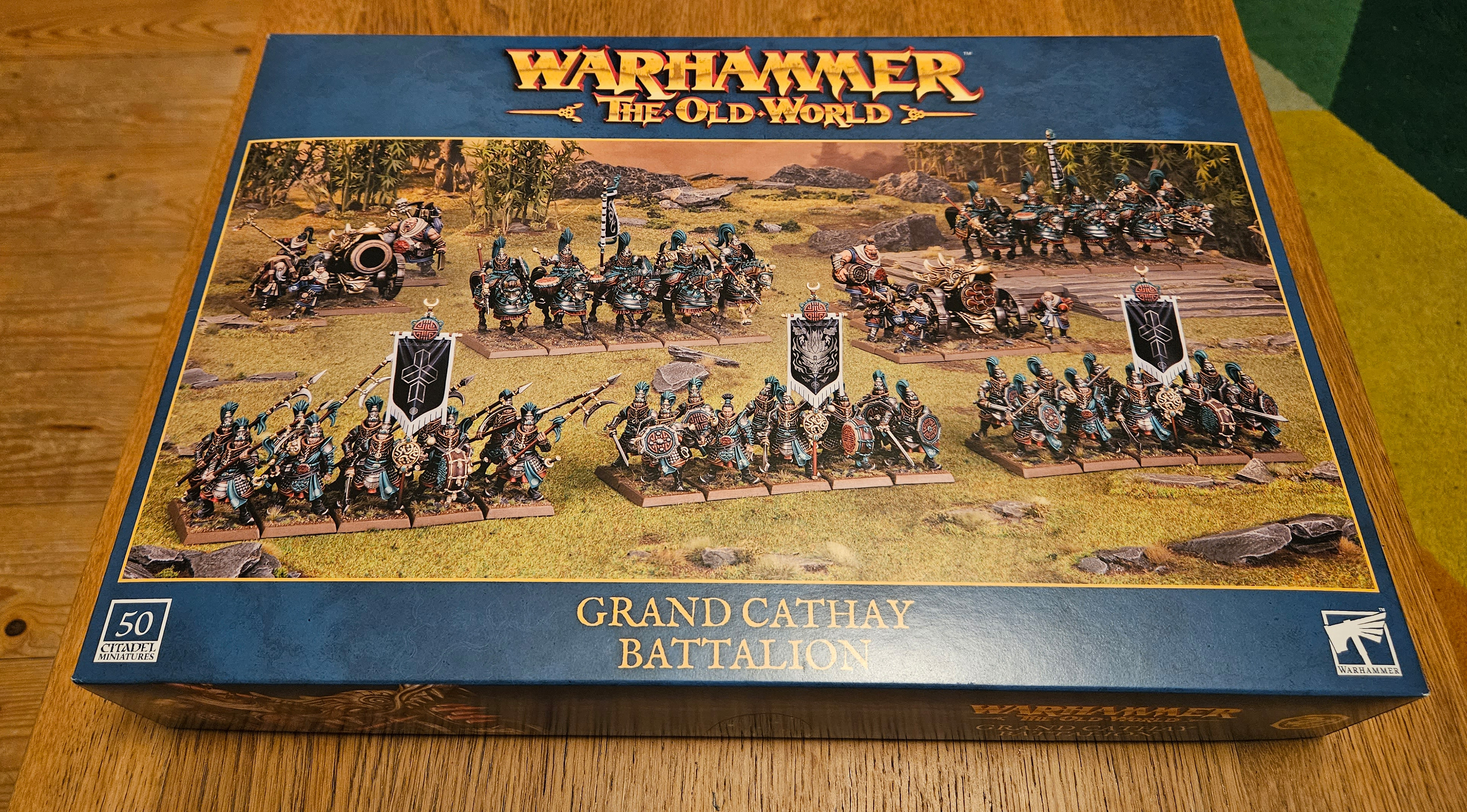 The Warhammer: The Old World - Grand Cathay Battalion box set on a desk.