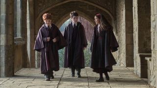 Harry, Ron, and Hermione on the grounds of Hogwarts in HBO's Harry Potter TV Show