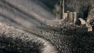 Gandalf leads the Rohirrim into battle against the Uruk-Hai in Lord of the Rings: The Two Towers