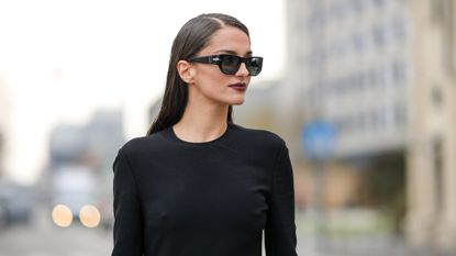 Best lipsticks for pale skin - Gabrielle Caunesil wears black sunglasses, a black long sleeves / long slit dress from Prada - gettyimages 1469086752